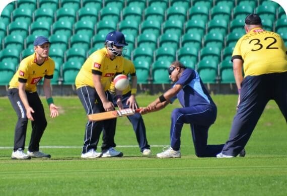 5 guys playing cricket