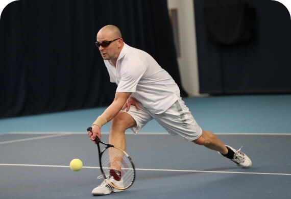 a guy playing tennis