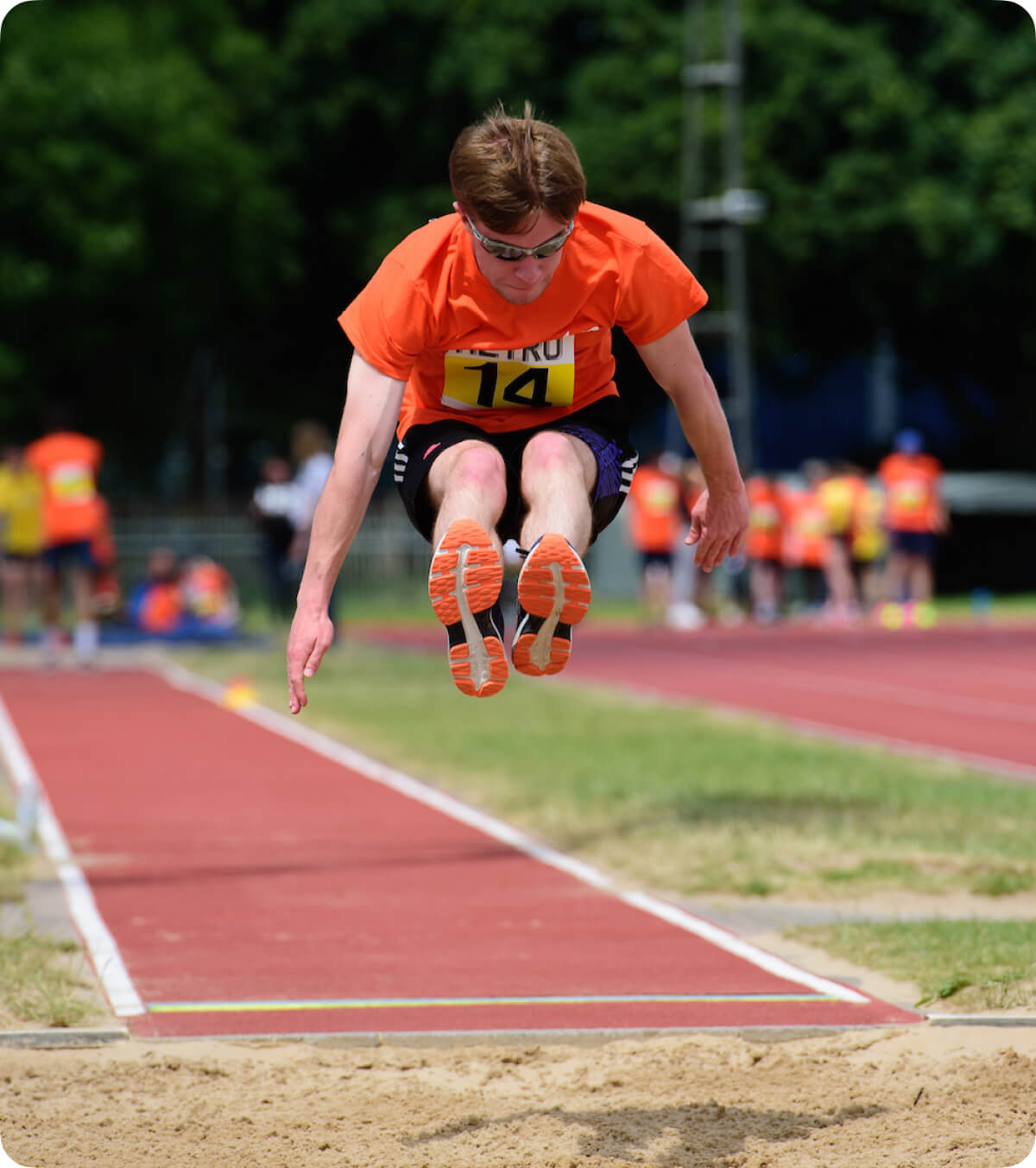 man doing a distance jump