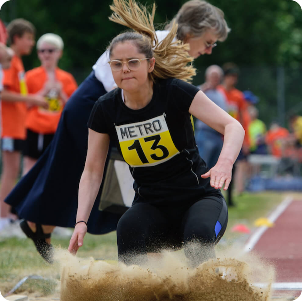 a girl participating in the long jump event