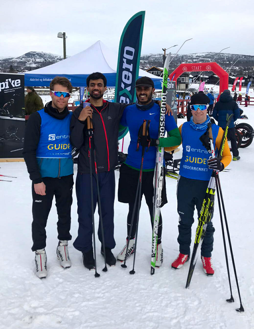 4 skiers posing for the group photo