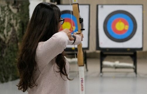 woman playing archery