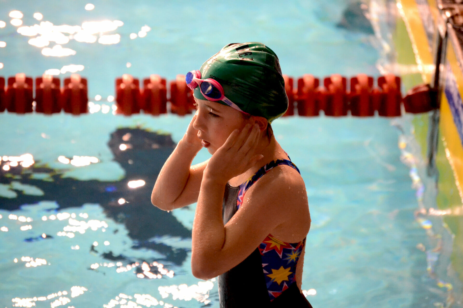 a girl ready to swim in the pool